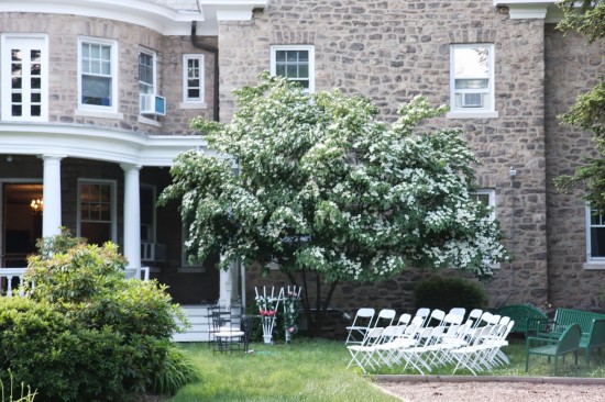 The setting of Act 2, at John Worthington’s country home, in the garden of the Lewis house.