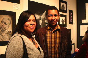 Eighth grader MaHadaye LeCounte of Mariner Middle School in Milton, with his mother. He received an Honorable Mention for his short story, "So Close."