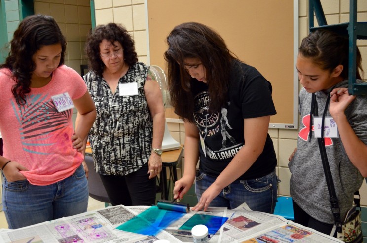 Laura Youngbird (second from left), program director for Native American artist outreach at the Plains Art Museum, led a printmaking workshop for students