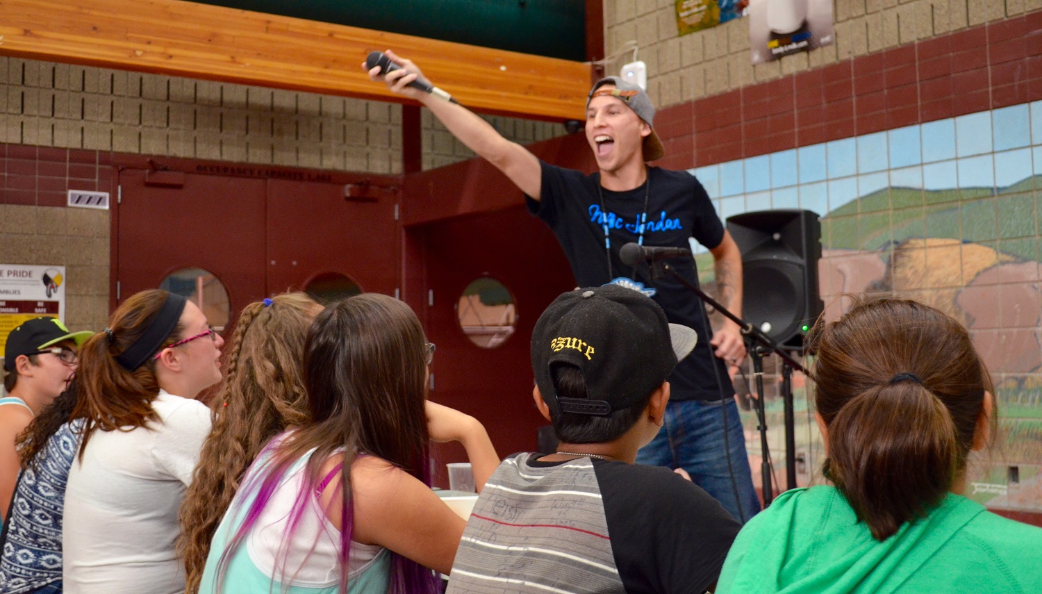 Native hip hop artist Mic Jordan, a graduate of Turtle Mountain School, engages the students in singing with him