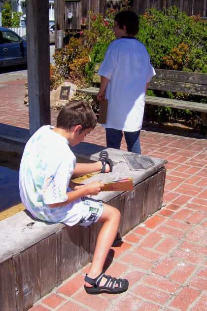 Youth sketching around town